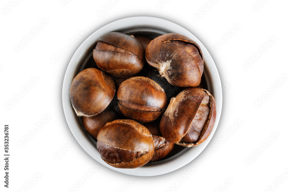 Chestnuts in a white bowl on a white isolated background Chestnuts in a white bowl on a white isolated background