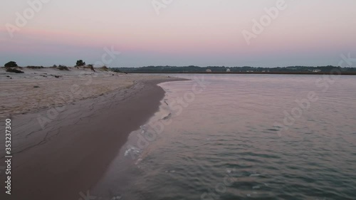 Florida Beach at Sunrise Aerial Zooming Low and Across