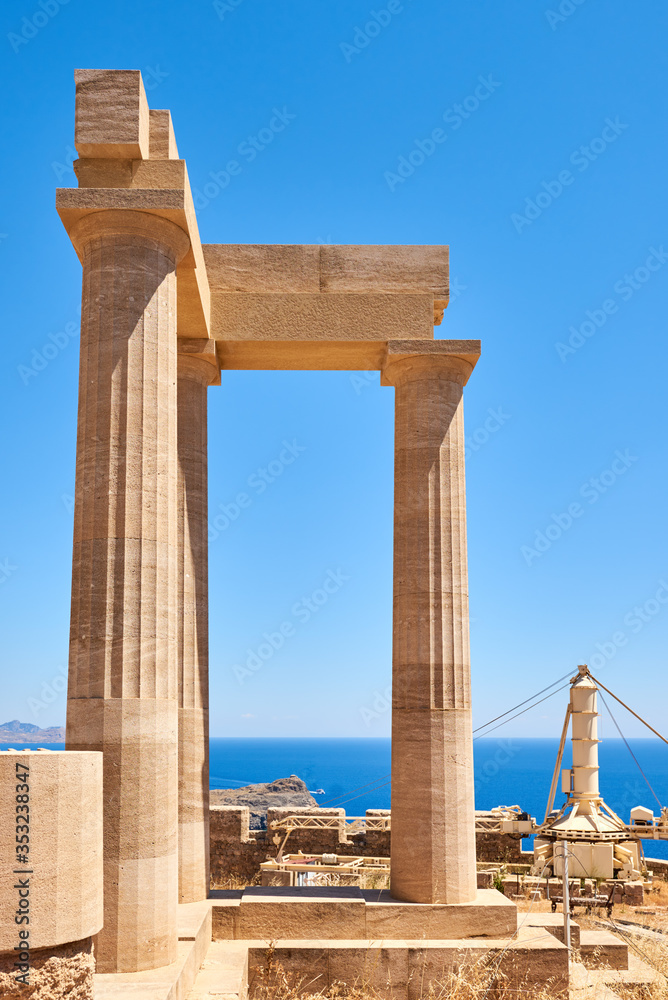 Ancient columns in the Acropolis of famous Lindos town in Rhodes. Greece