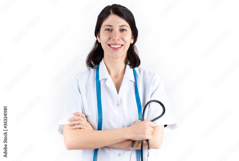 Young woman doctor with stethoscope and tape measure.Isolated on white background. Healthcare and medicine concept. Young woman doctor with stethoscope and tape measure.Isolated on white background. Healthcare and medicine concept.