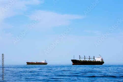Cargo ships traveling across the ocean
