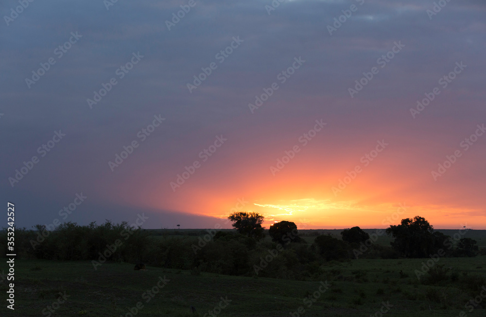 A beautiful Landscape of Masai Mara during sunset with dense cloud