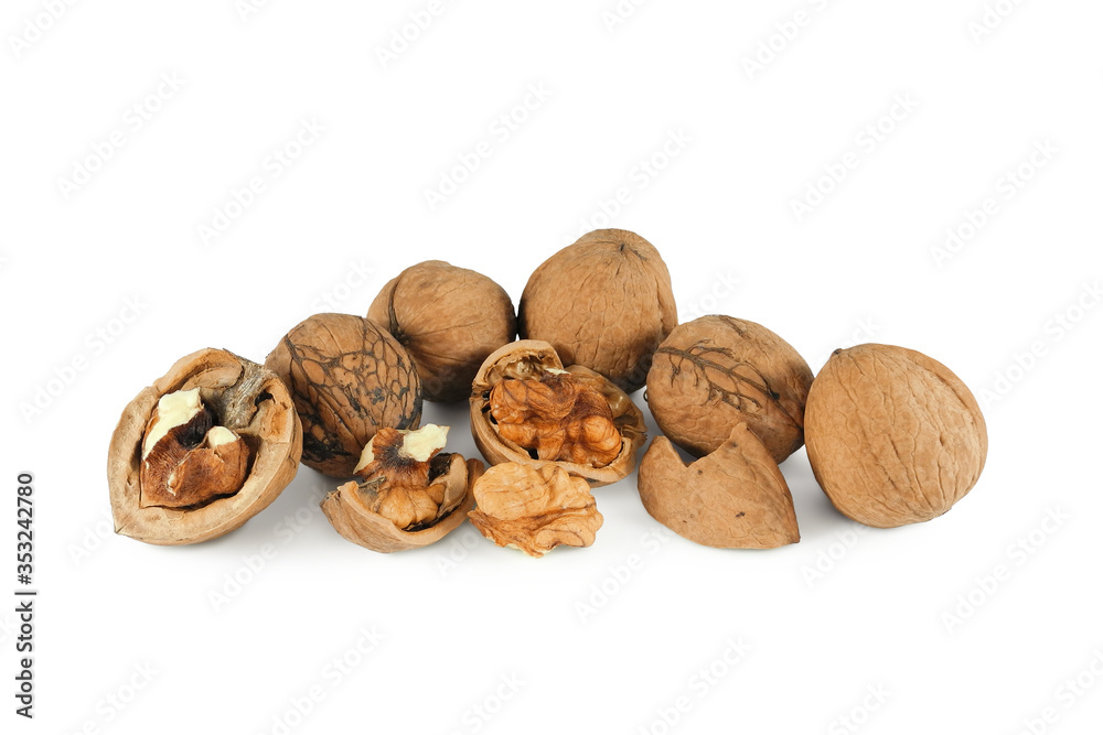 Heap of walnuts whole and chopped isolated on white background Heap of walnuts whole and chopped isolated on white background