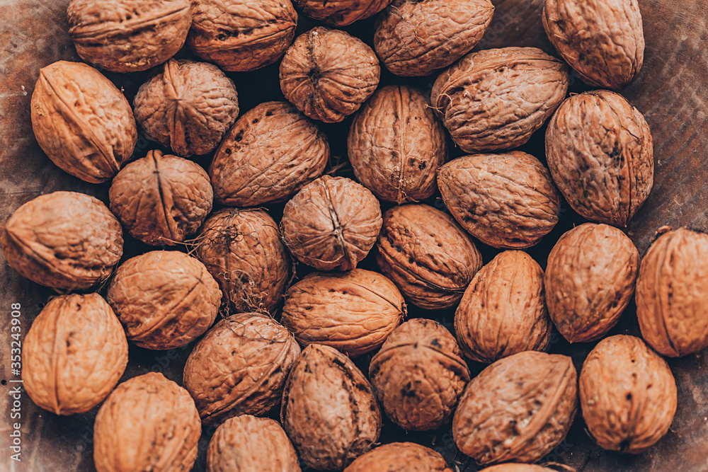Walnuts on a wooden table. Macro image. Walnuts on a wooden table. Macro image.