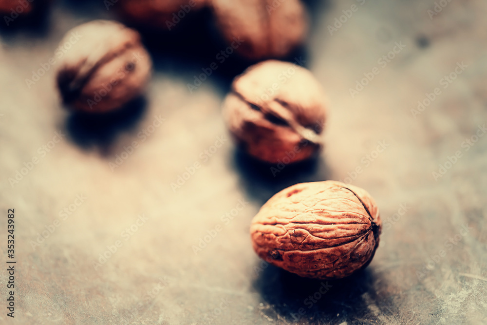 Walnuts on a wooden table. Macro image.