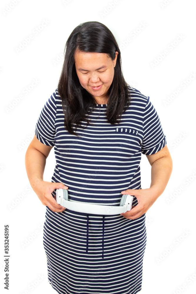 concept pregnancy and music. belly of pregnant woman and headphones on the White background, Unborn baby listening music in mother's belly, concept pregnancy and music. belly of pregnant woman and headphones on the White background, Unborn baby listening music in mother's belly,