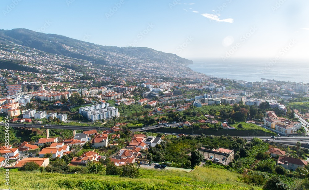 View of Funchal city, the surrounding hills and the ocean from Pico dos Barcelos lookout point, Madeira