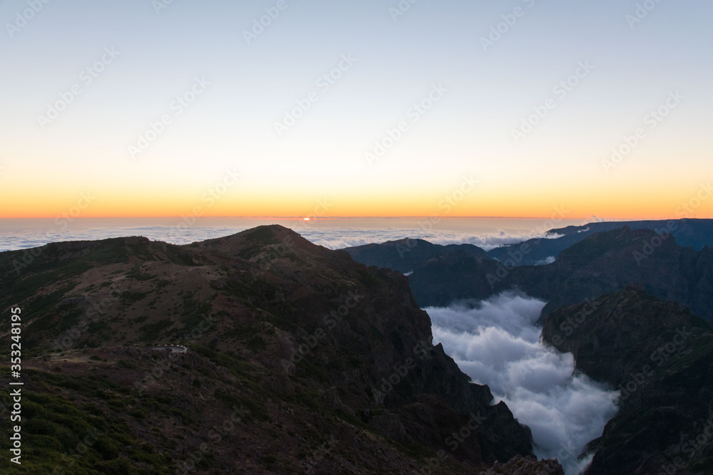 View of clouds filling in the valley at Pico Ruivo at sunset View of clouds filling in the valley at Pico Ruivo at sunset