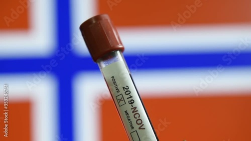 Corona virus or Covid-19 in Norway, sample blood tube with Norway flag on background