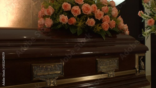 coffin with flowers in chapel