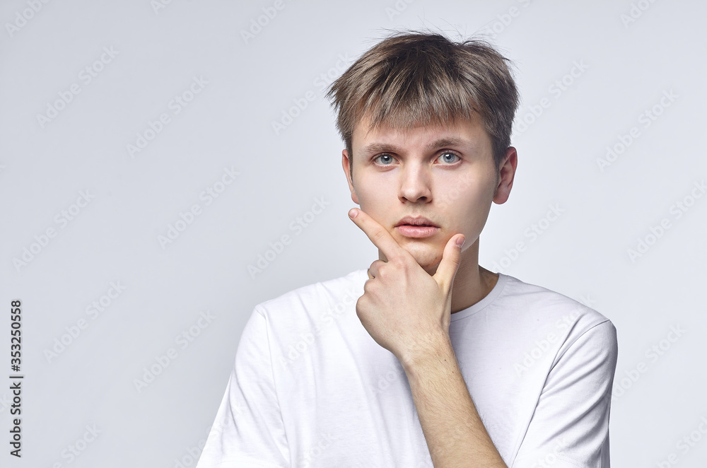 The young guy shows various emotions. Talented portrays the inner state and mood. Advertisement concept The young guy shows various emotions. Talented portrays the inner state and mood. Advertisement concept