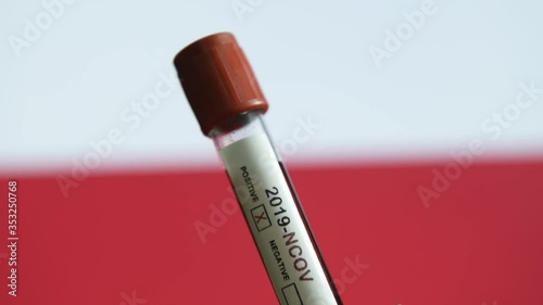 Corona virus or Covid-19 in Poland , sample blood tube with Poland flag on background