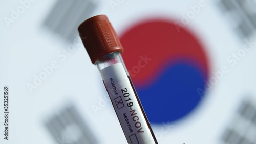 Corona virus or Covid-19 in south Korea, sample blood tube with south Korea flag on background