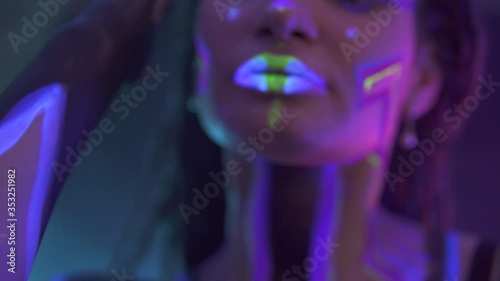 Wallpaper Mural Portrait of a Girl with Dreadlocks in Neon UF Light. Model Girl with Fluorescent Creative Psychedelic MakeUp, Art Design of Female Disco Dancer Model in UV, Colorful Abstract Make-Up. Dancing Lady Torontodigital.ca
