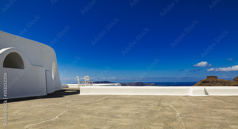 Obraz premium Chairs of Santorini, one of the well-known benches of Santorini