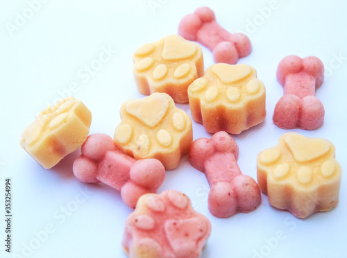 DIY cool colorful yogurt dog treats on plain white background.