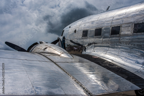 Photos Cloudreflections on the metal skin of an oldtimer piston engine airliner