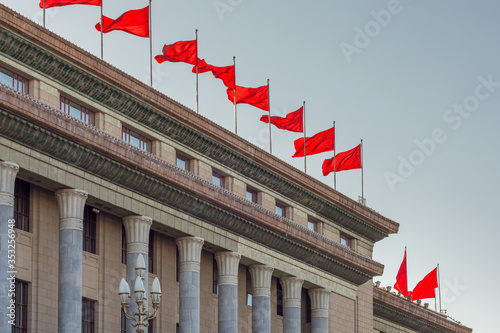 Red banners atop the National People`s Congress in Beijing, China photo