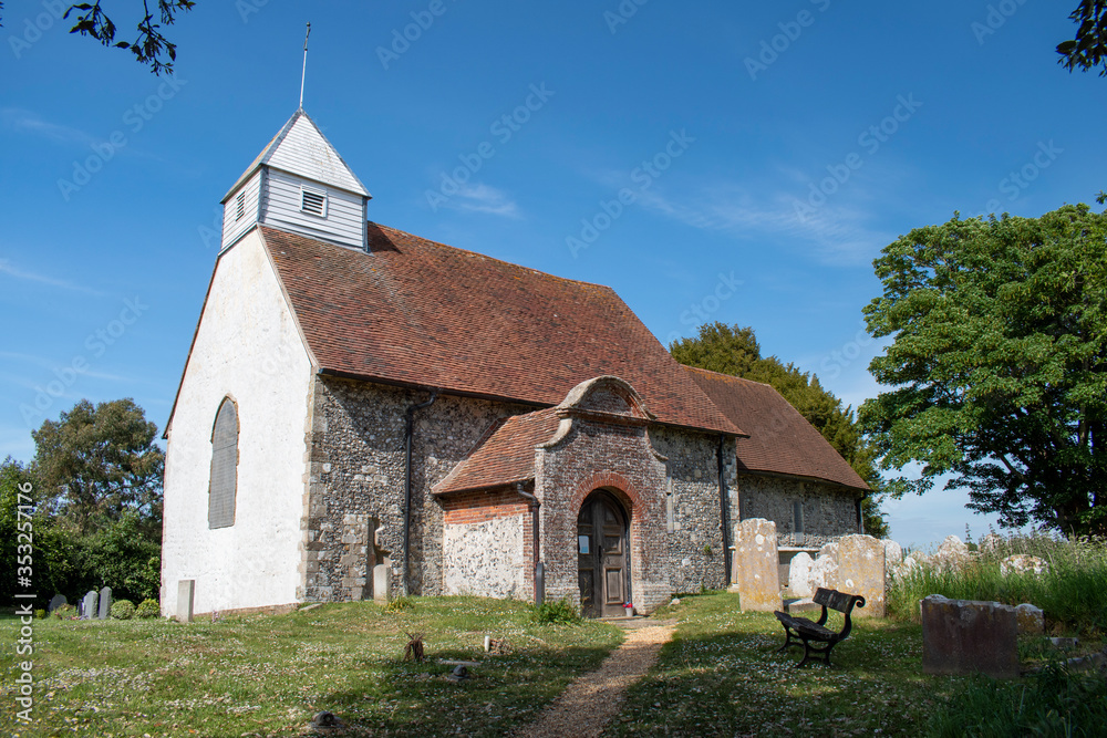 St Andrew's Church of Ford and Yapton in West Sussex is a small historic village church of Saxon origin footage on a warm and sunny day in England.