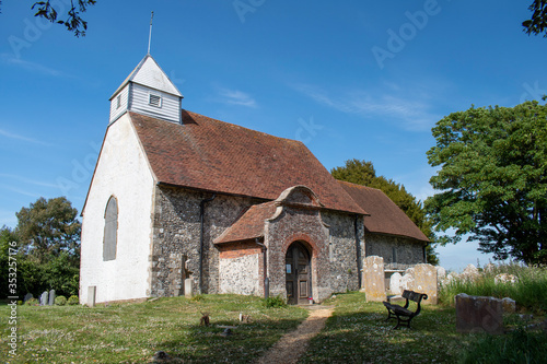 St Andrew's Church of Ford and Yapton in West Sussex is a small historic village church of Saxon origin footage on a warm and sunny day in England.
