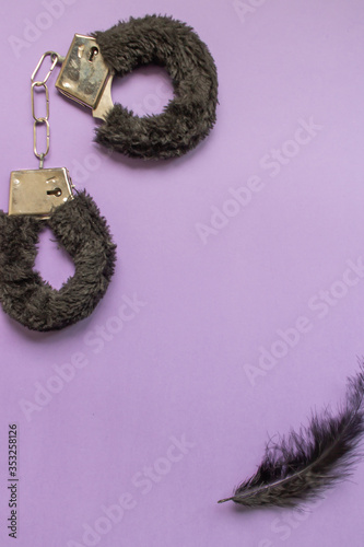 Different sex toys are on a purple background. Idea for sex shop advertising. Adult content.