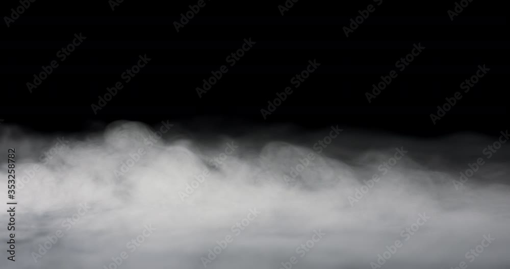 heavy fog passing across a black background.