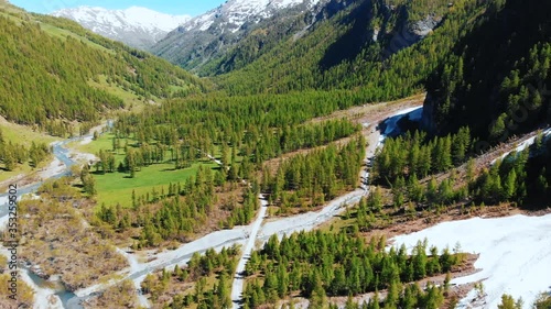 alps mountains piedmont valley flight in a sunny day. aerial view