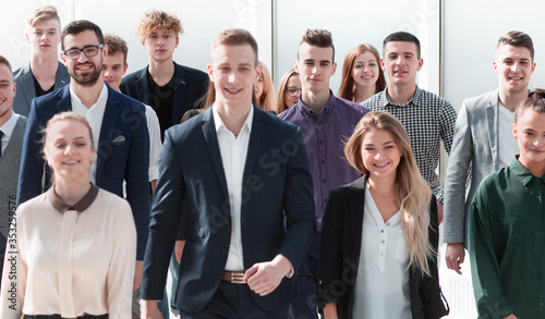 Принти на полотні group of ambitious young people walking in a new office