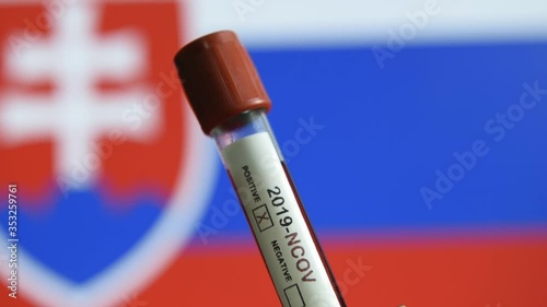 Corona virus or Covid-19 in Slovakia , sample blood tube with Slovakia flag on background