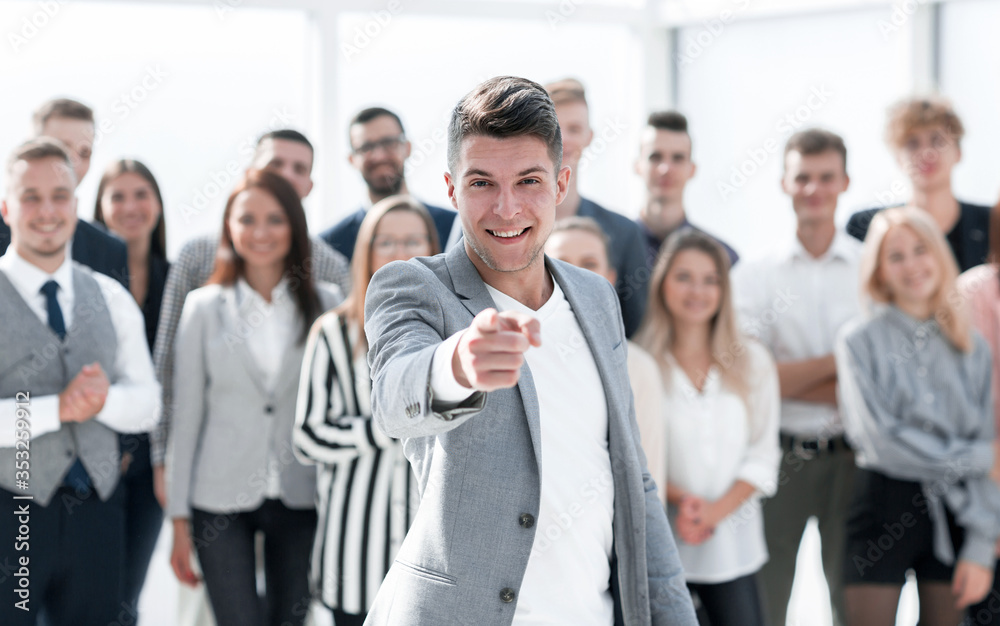 confident young businessman pointing at you . concept of choice
