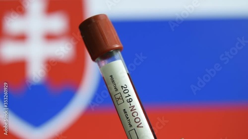 Corona virus or Covid-19 in Slovakia , sample blood tube with Slovakia flag on background