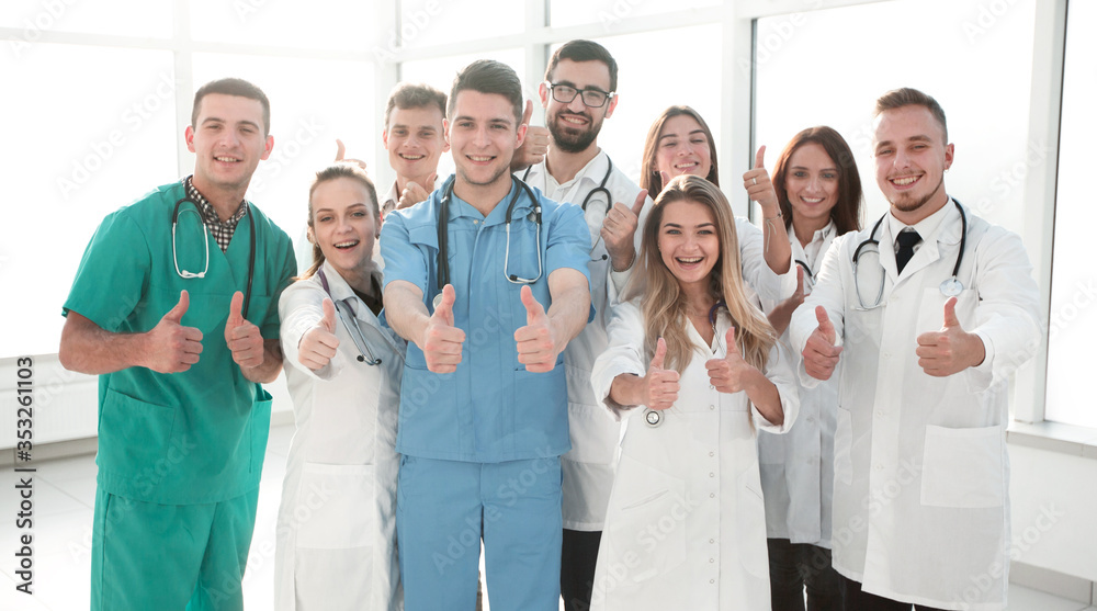 diverse medical professionals giving a thumbs up diverse medical professionals giving a thumbs up