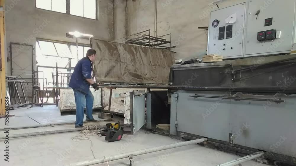 Male welder repairing equipment on the plant. Male welder repairing equipment on the plant.
