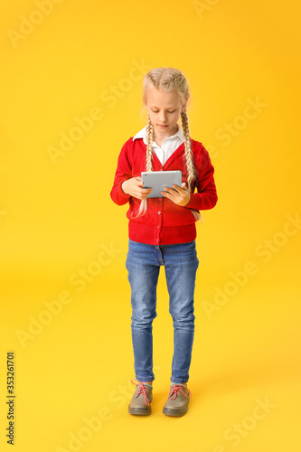 Cute little girl with table...