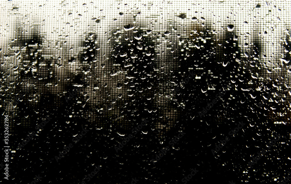 Drops on the glass on a dark background