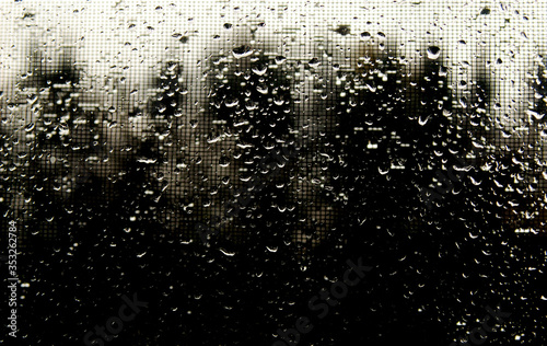 Drops on the glass on a dark background