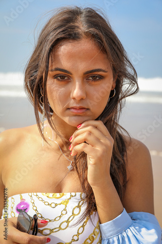 Beautiful close-up girl on the beach.