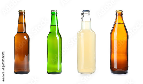 Set with different beer bottles on white background