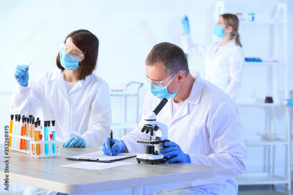 Scientists working in modern laboratory