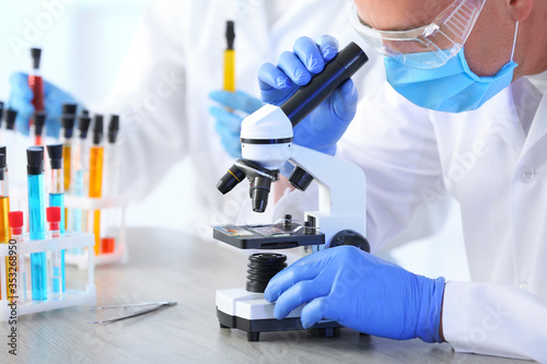 Scientist working with micr...