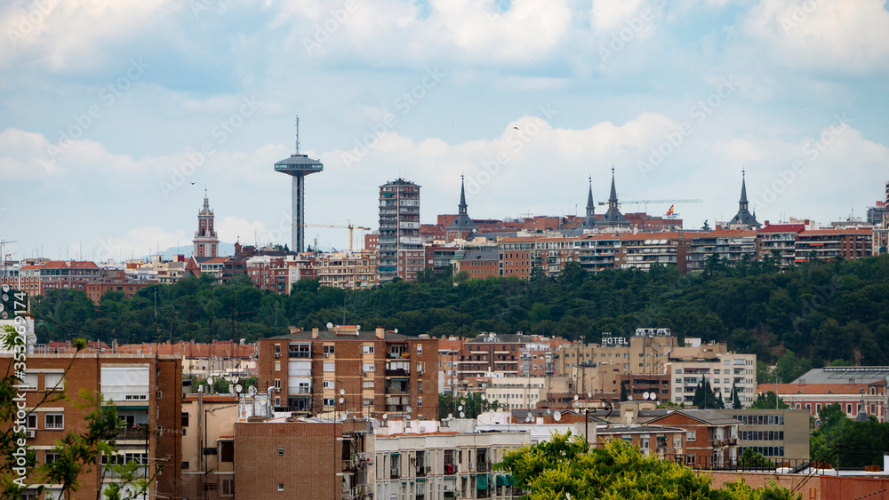 MADRID, SPAIN ,MARCH 19, 2020: PANORAMIC VIEW OF PART OF MADRID WITH ITS TRAFFIC CONTROL TOWER IN THE BACKGROUND, MONCLOA.
