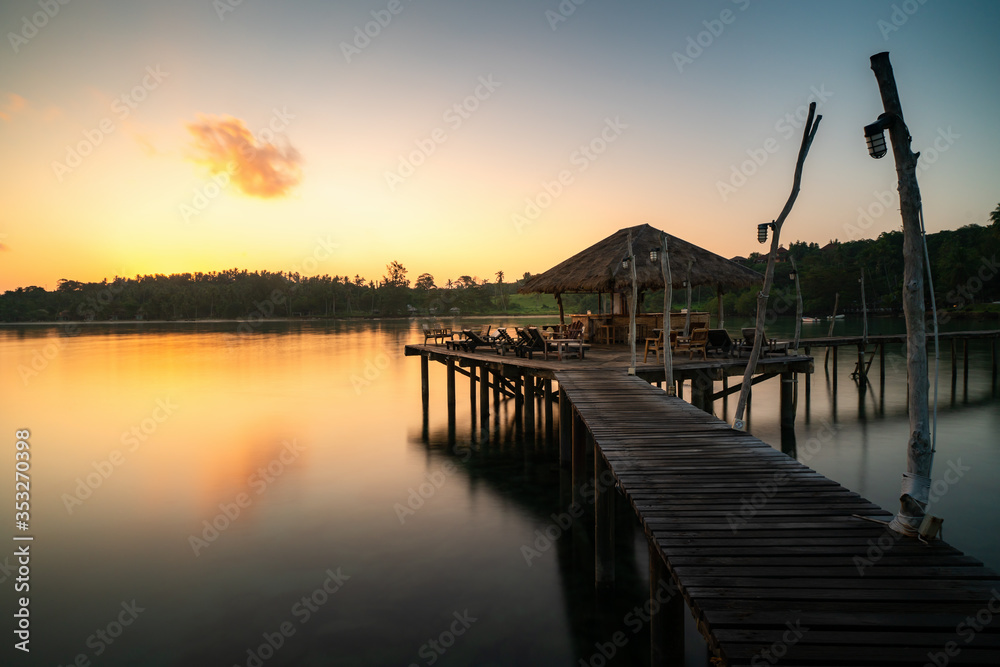 Wooden bar in sea and hut with clear sunrise sky in Koh Mak at Trat, Thailand. Landscape and travel, or nature and sightseeing in summer concept