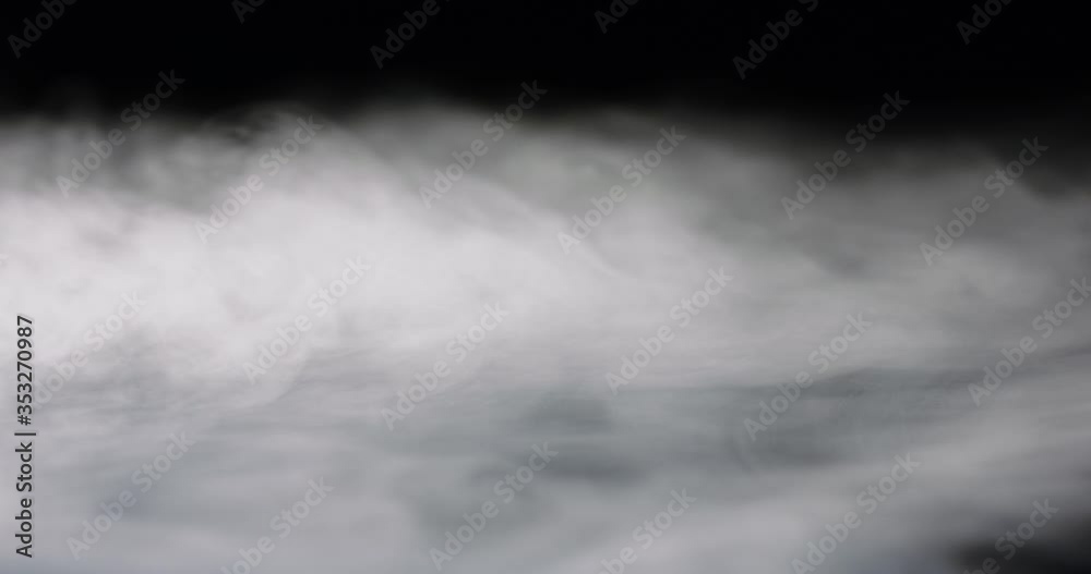 heavy thick fog filling a black background.
