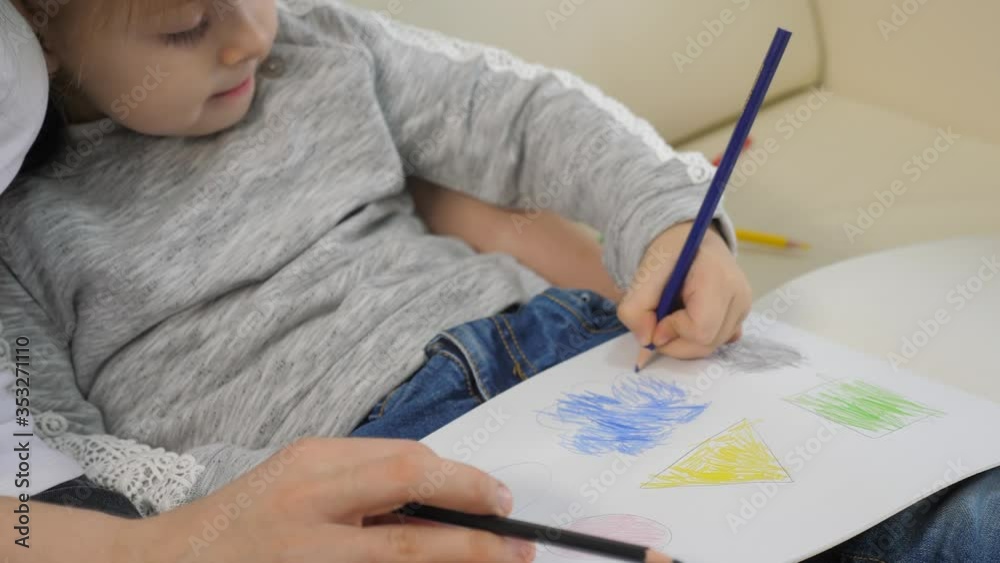 little girl and mom draw teamwork happy family concept. lifestyle child daughter with woman a are engaged in pencil drawing lesson with children development of creativity little girl and mom draw teamwork happy family concept. lifestyle child daughter with woman a are engaged in pencil drawing lesson with children development of creativity
