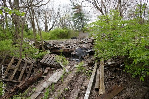 Demolished remains of old wooden house debris