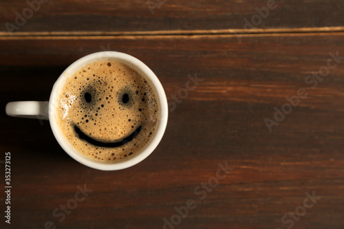 White cup of coffee. View from the top. Smile in the form of coffee