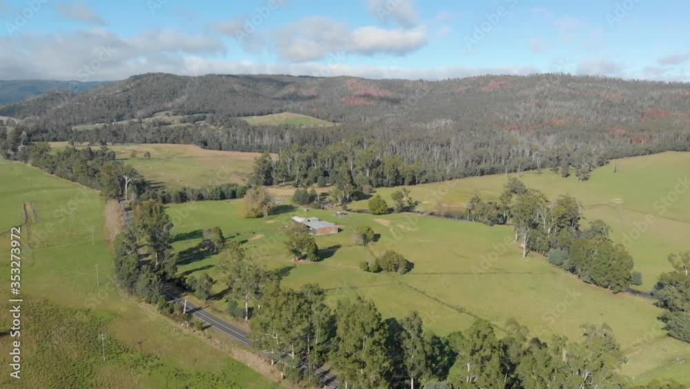Aerial shot moving forward over farm land in Victoria's high country. Aerial shot moving forward over farm land in Victoria's high country.