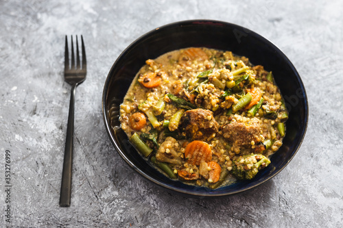plant-based food, vegan buckwheat stew with carrots green beans and falafels