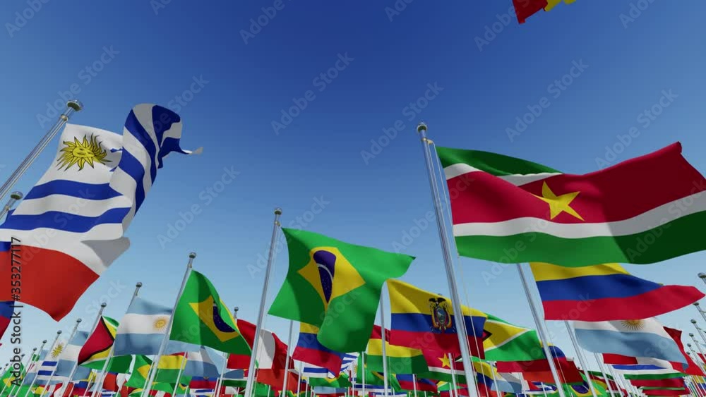 Many South America countries flagsv. Various world flags waving on flagpoles against blue sky. 3d rendering animation.