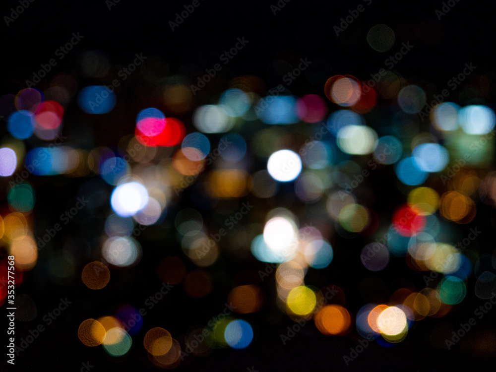 Abstract Colorful bokeh night garden in city background background.